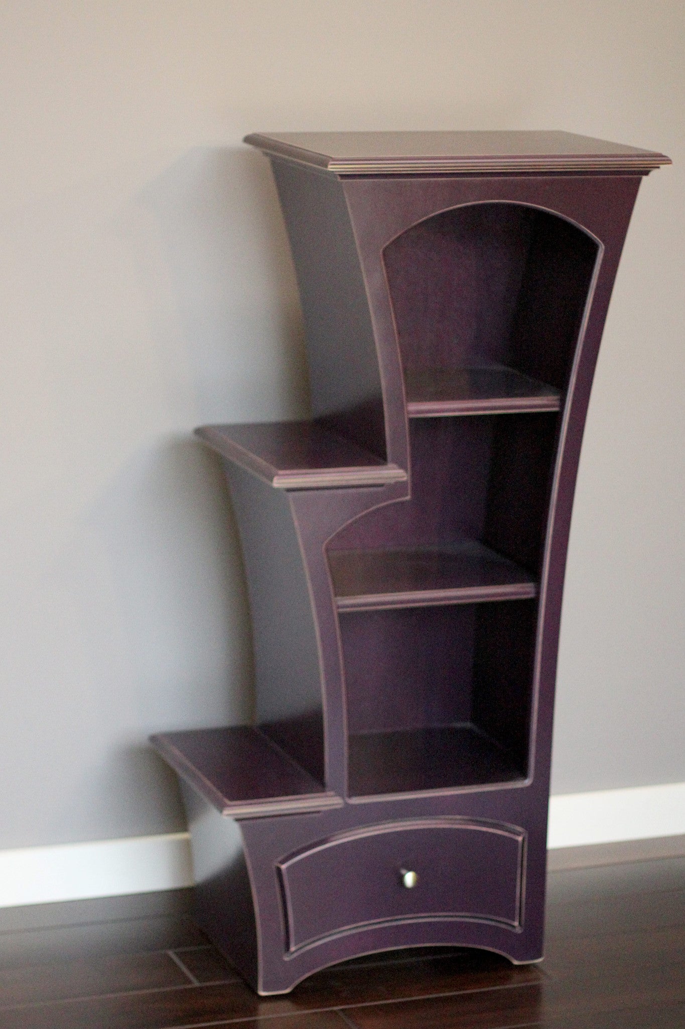 Stepped display bookcase in dark violet paint